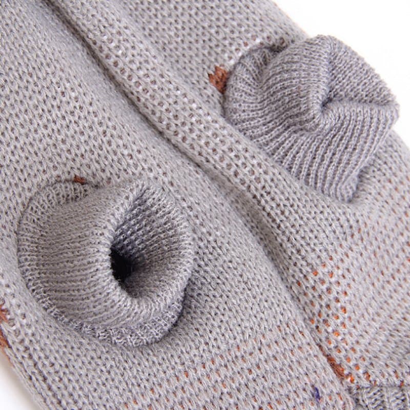 Close-up of stretch sleeve openings on a gray knit pet sweater