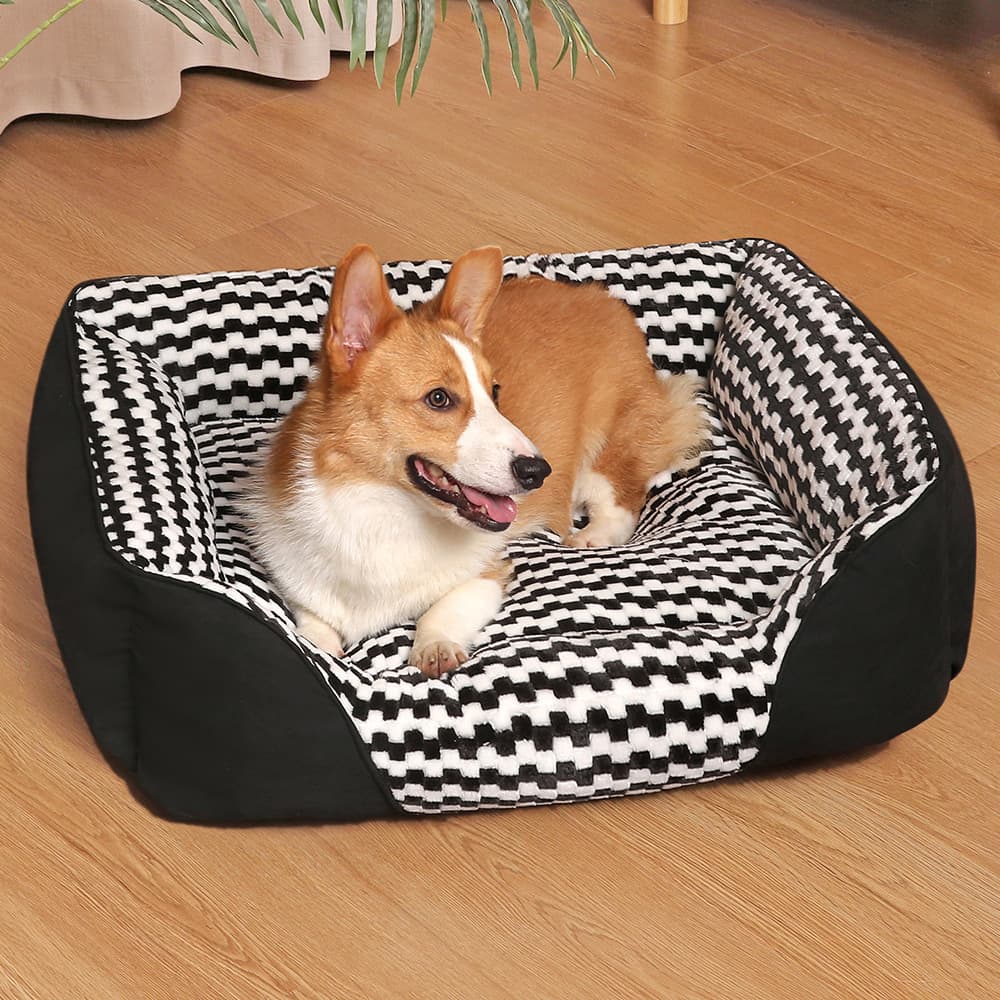 Black square checkered plush dog bed used for indoor lounging