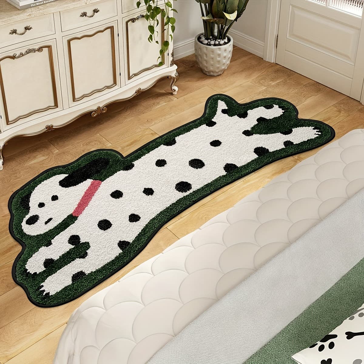 Green spotted dog shaped plush bedside mat in a bedroom